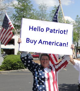 Connie holding sign to encourage patriots to Buy American!